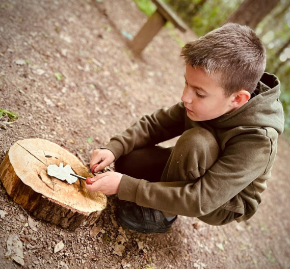 Student partaking in a forest school lesson